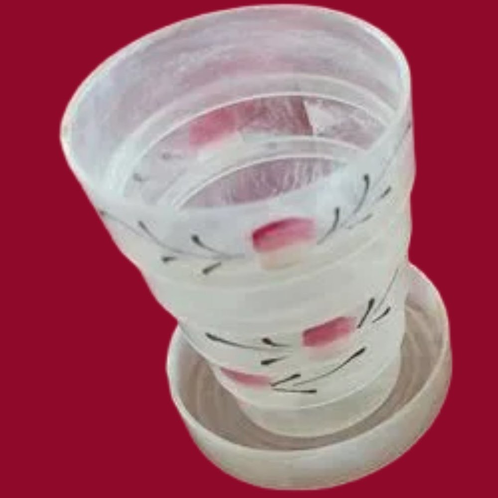 Vintage Collapsible Cup with pill holder in the Lid